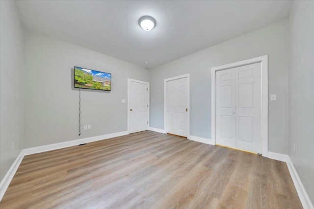 2521 Feather Garden Cir, Vinton, VA 24179 - unfurnished bedroom featuring wood finished floors and baseboards