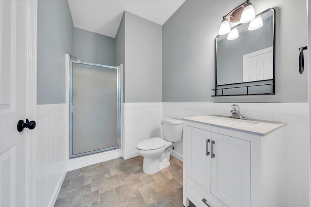 2521 Feather Garden Cir, Vinton, VA 24179 - full bathroom featuring a stall shower, wainscoting, toilet, vanity, and stone finish floors