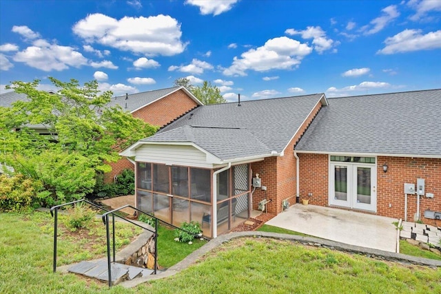 2521 Feather Garden Cir, Vinton, VA 24179 - back of property with a sunroom, a patio area, brick siding, and a yard