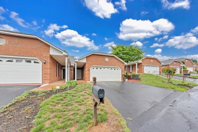 2521 Feather Garden Cir, Vinton, VA 24179 - ranch-style house featuring driveway, brick siding, an attached garage, fence, and a residential view