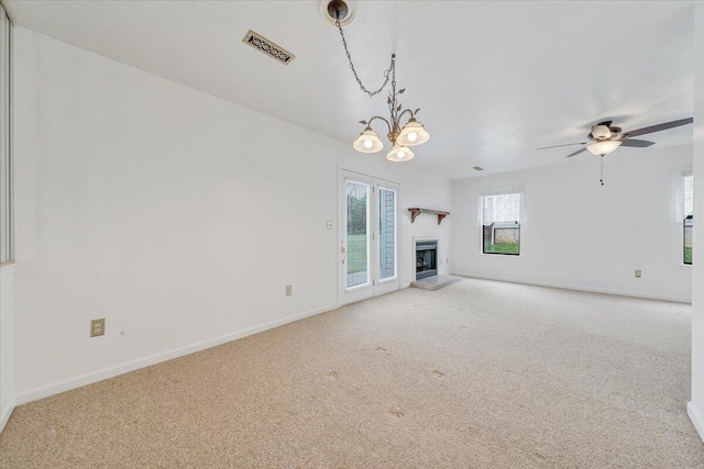 7204 Snowberry Cir, Roanoke, VA 24019 - unfurnished living room featuring carpet floors, a fireplace with raised hearth, baseboards, and a ceiling fan