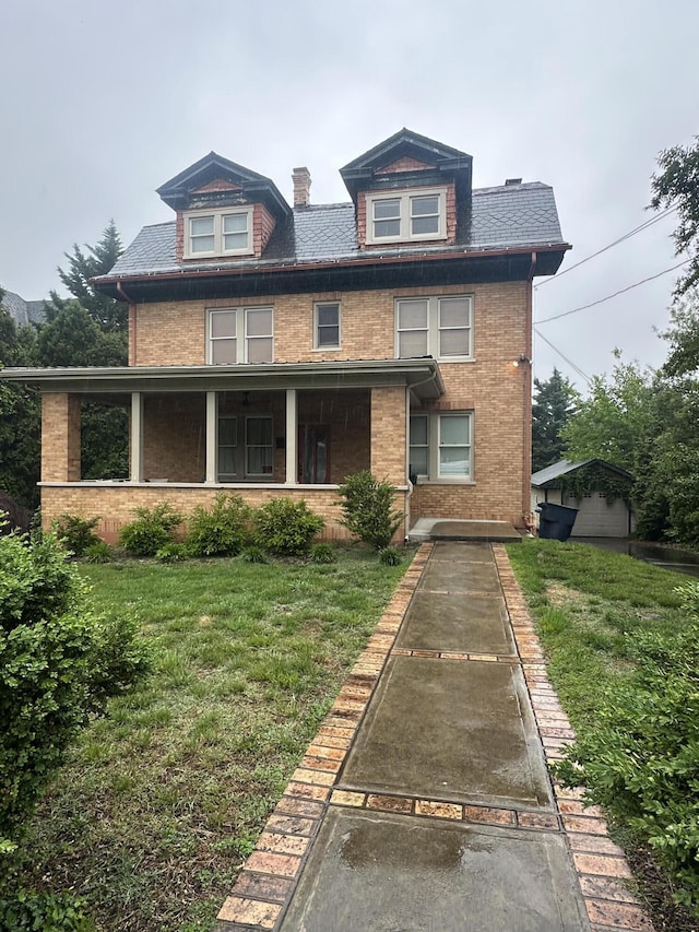 2319 Avenham Ave SW, Roanoke, VA 24014 - view of front of house featuring brick siding, a front yard, and a chimney