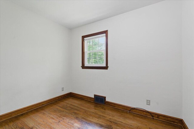 66 Adrian St, Bassett, VA 24055 - empty room featuring wood finished floors and baseboards