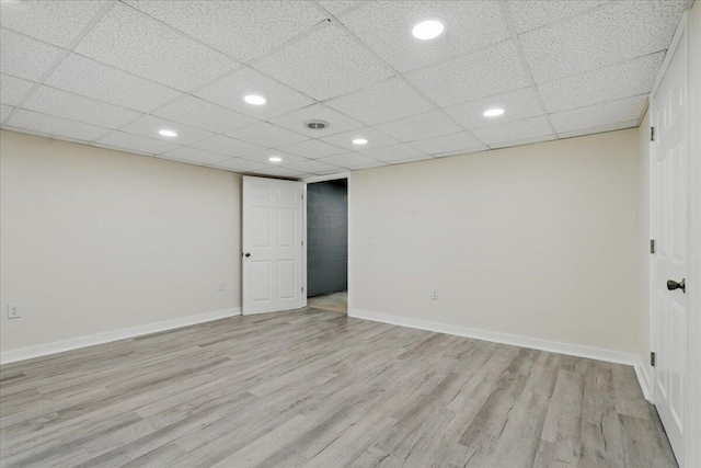unfurnished room featuring light wood-type flooring, recessed lighting, and baseboards