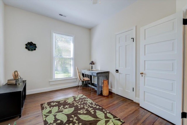 interior space featuring wood finished floors and baseboards