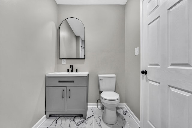 475 S Main St, Rocky Mount, VA 24151 - half bathroom featuring marble finish flooring, baseboards, toilet, and vanity