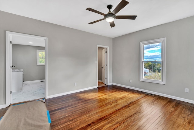 475 S Main St, Rocky Mount, VA 24151 - unfurnished bedroom featuring baseboards, hardwood / wood-style flooring, and ensuite bath