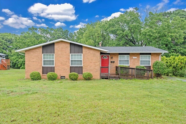 single story home featuring brick siding and a front lawn