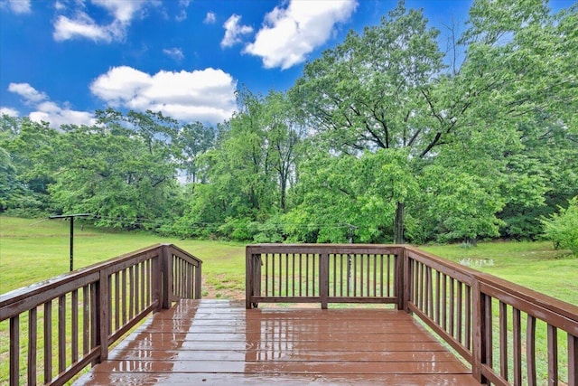 wooden deck with a lawn