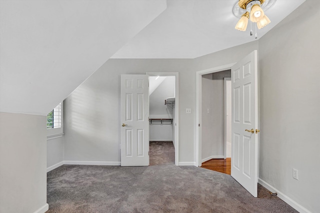 additional living space featuring carpet, ceiling fan, and baseboards