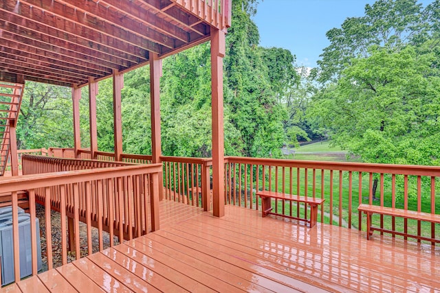 wooden terrace with view of scattered trees