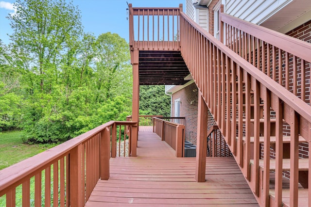 wooden deck featuring stairs