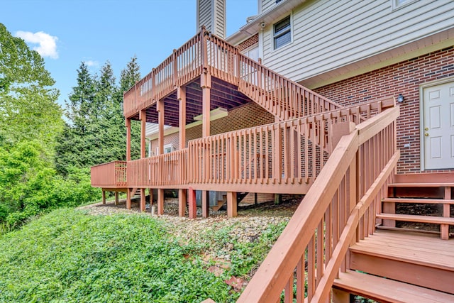 wooden terrace featuring stairs