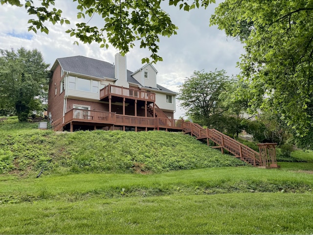 back of house with a wooden deck, a chimney, and stairway