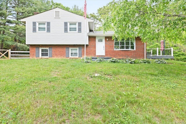 split level home with brick siding