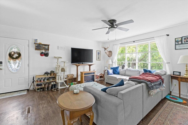 living area featuring ceiling fan and wood finished floors
