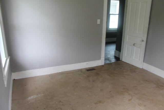 705 Rose Ave, Clifton Forge, VA 24422 - empty room with concrete flooring