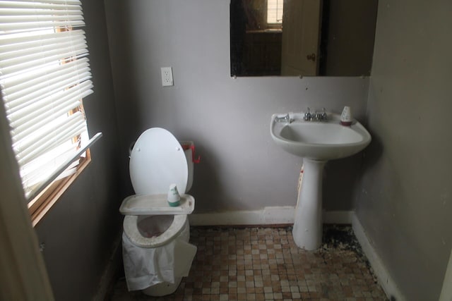 705 Rose Ave, Clifton Forge, VA 24422 - bathroom with plenty of natural light, baseboards, and toilet