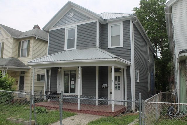 705 Rose Ave, Clifton Forge, VA 24422 - view of front of house featuring a porch, a gate, a fenced front yard, and metal roof