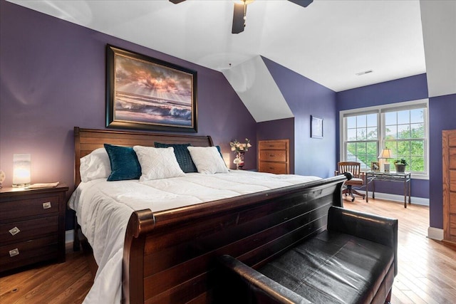 bedroom with wood finished floors, baseboards, and ceiling fan