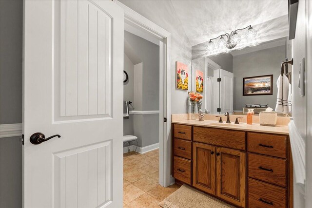 bathroom with vanity and tile patterned flooring