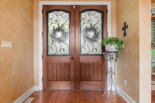 entrance to property featuring french doors
