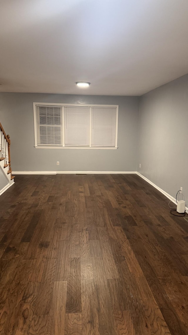 100 View Dr, Goodview, VA 24095 - unfurnished room with stairway, dark wood finished floors, and baseboards