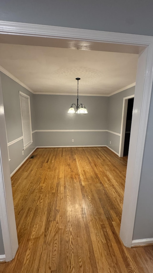 100 View Dr, Goodview, VA 24095 - unfurnished room with wood finished floors, crown molding, a chandelier, and baseboards