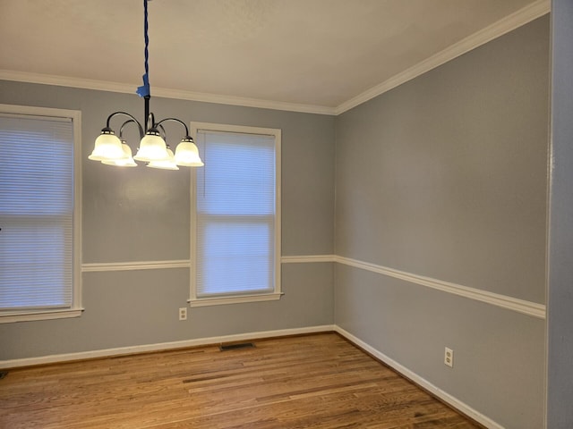 100 View Dr, Goodview, VA 24095 - spare room with wood finished floors, a chandelier, baseboards, and crown molding