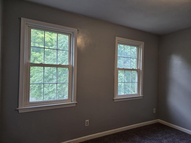 100 View Dr, Goodview, VA 24095 - unfurnished room with plenty of natural light, baseboards, and dark colored carpet