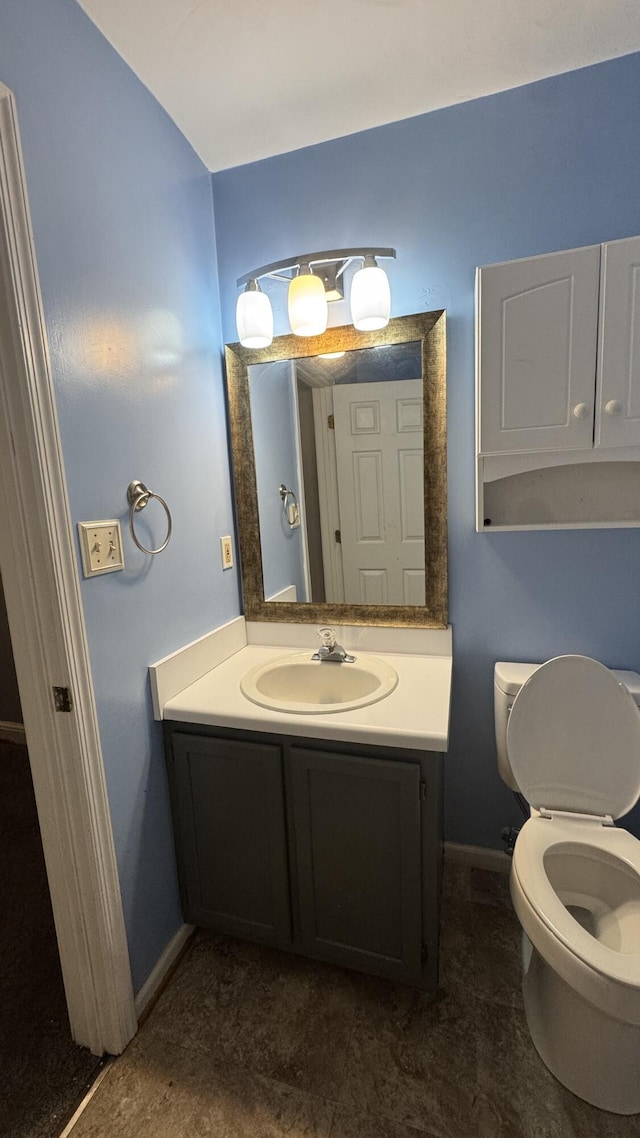 100 View Dr, Goodview, VA 24095 - bathroom with baseboards, vanity, and toilet