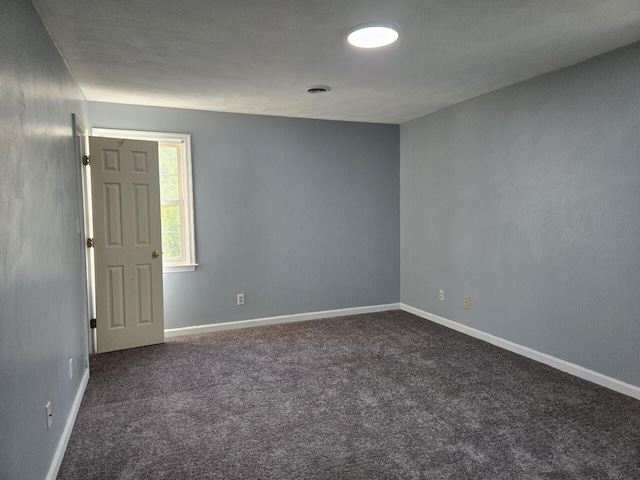 100 View Dr, Goodview, VA 24095 - unfurnished room with dark colored carpet and baseboards