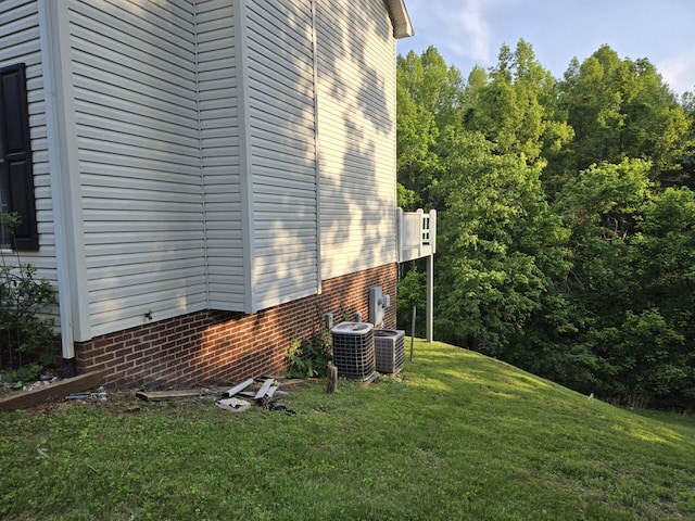 100 View Dr, Goodview, VA 24095 - view of home's exterior with central AC unit and a lawn