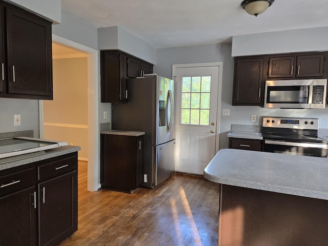 100 View Dr, Goodview, VA 24095 - kitchen with stainless steel appliances, dark wood finished floors, light countertops, and dark brown cabinetry