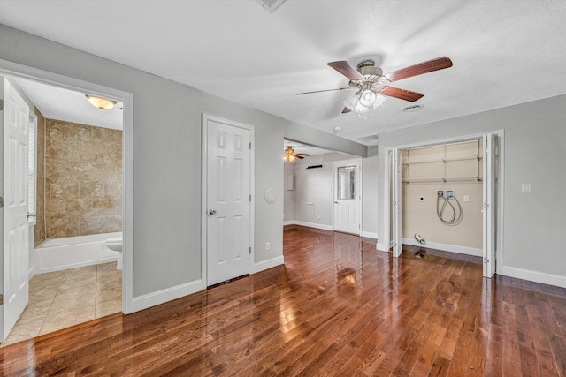 1841 Old Franklin Tpke, Rocky Mount, VA 24151 - unfurnished living room featuring a ceiling fan, wood finished floors, and baseboards
