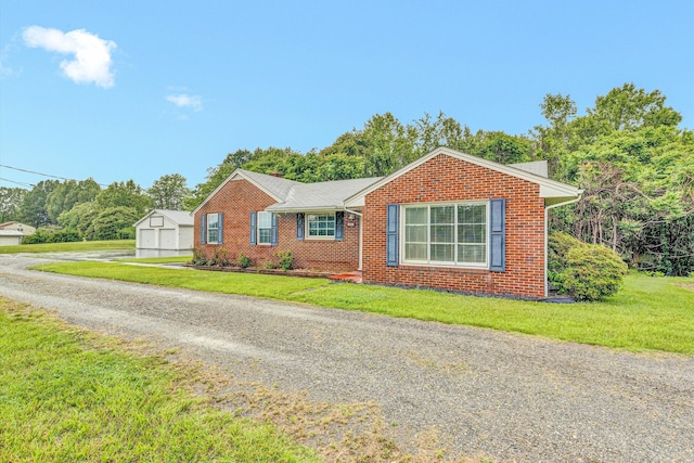 1841 Old Franklin Tpke, Rocky Mount, VA 24151 - view of front of home with a front lawn, brick siding, driveway, and an outbuilding