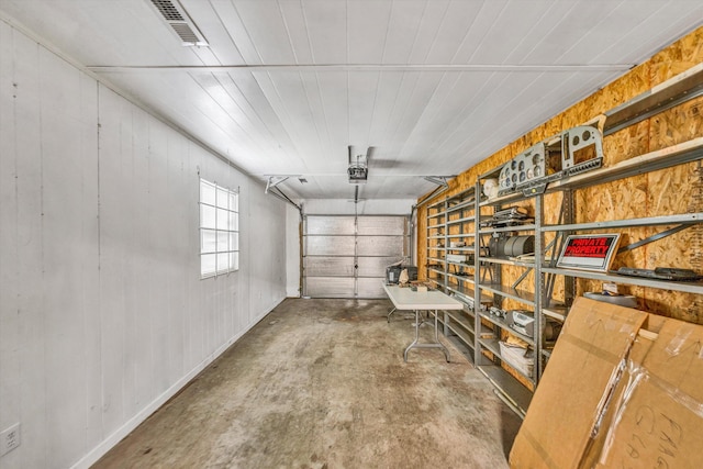 1841 Old Franklin Tpke, Rocky Mount, VA 24151 - garage featuring wood walls and a garage door opener