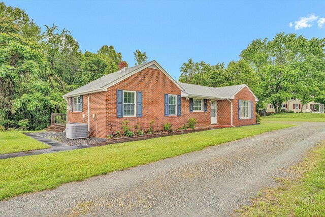 1841 Old Franklin Tpke, Rocky Mount, VA 24151 - view of front of property featuring brick siding, central AC unit, a chimney, and a front yard