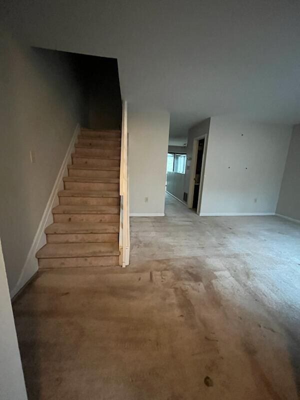staircase with carpet flooring and baseboards