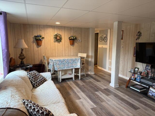 1134 Coolbrook Rd, Bedford, VA 24523 - living room with wood finished floors, wooden walls, baseboards, and a drop ceiling