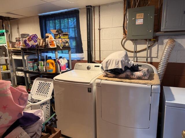1134 Coolbrook Rd, Bedford, VA 24523 - laundry room featuring electric panel, washing machine and dryer, and concrete block wall