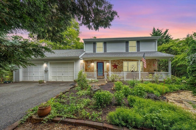 6553 Pencheck Cir, Roanoke, VA 24018 - traditional-style house with a garage, asphalt driveway, and covered porch