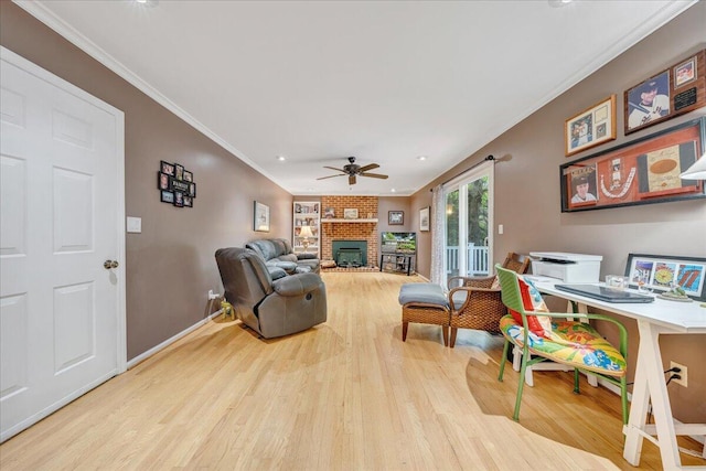 6553 Pencheck Cir, Roanoke, VA 24018 - living area featuring wood finished floors, crown molding, a ceiling fan, a brick fireplace, and baseboards