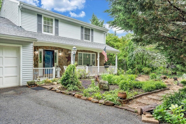 6553 Pencheck Cir, Roanoke, VA 24018 - view of front of house featuring covered porch, a shingled roof, and stone siding