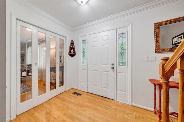 6553 Pencheck Cir, Roanoke, VA 24018 - foyer entrance with french doors, light wood-style floors, ornamental molding, and baseboards
