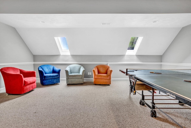 playroom with a skylight, lofted ceiling, carpet floors, baseboards, and recessed lighting