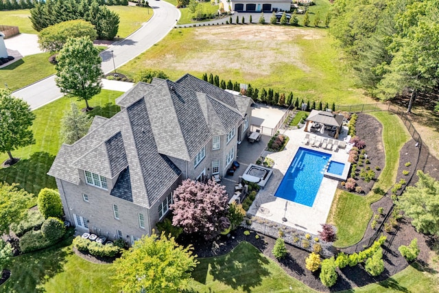 view from above of property featuring a pool area