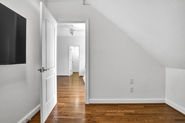 additional living space with lofted ceiling, wood finished floors, and baseboards
