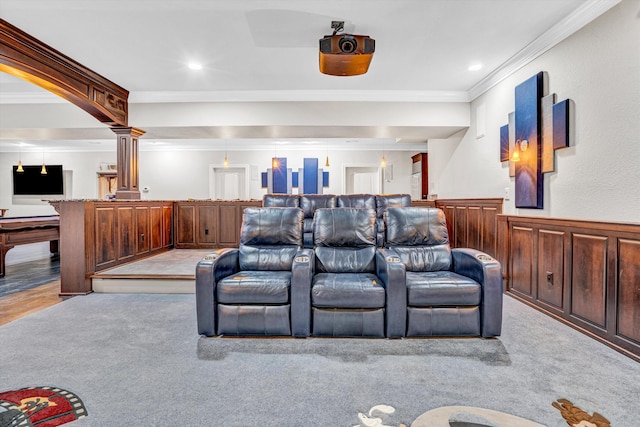 home theater with ornamental molding, a wainscoted wall, recessed lighting, and light colored carpet