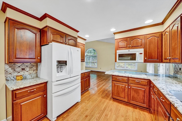 kitchen with white appliances, light wood-type flooring, decorative backsplash, recessed lighting, and baseboards